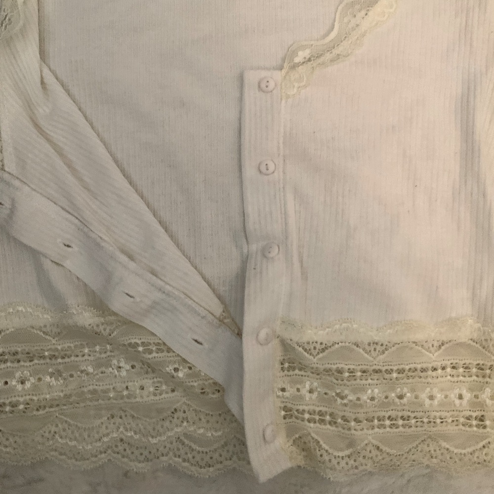 This is a button up white crop top.